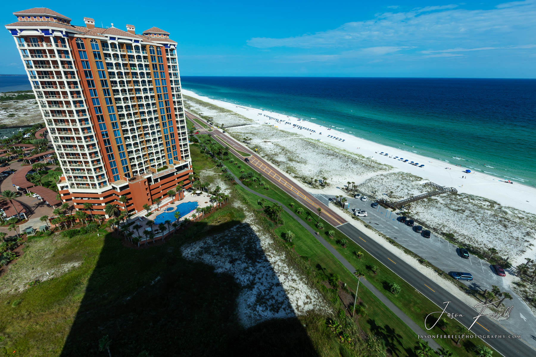 A photo of the Portofino Island Resort Towers, the beach, the highway and the Gulf of Mexico.