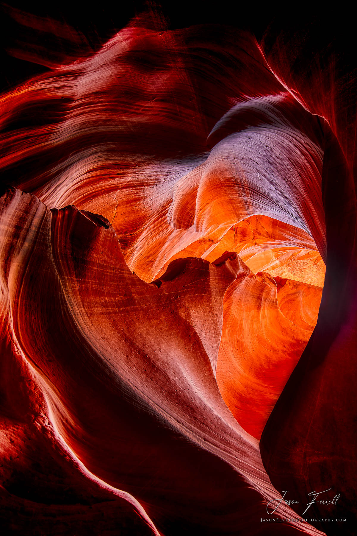 The deep red and purple colors of this eternally beautiful sandstone rock formation was formed by the timeless erosion of wind...